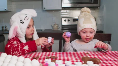 Christ is risen. Children play with Easter eggs, decorate and prepare for Easter Stock Footage 262760247