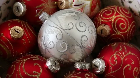 Christass decorations white and red balls on rotating table close-up. Stock-Footage 75298080