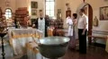 Christening of little baby in orthodox church (infant baptism) HD Footage