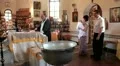 Christening of little baby in orthodox church (infant baptism) HD Footage
