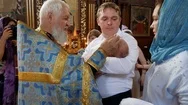 Christening Of Little Baby In Orthodox Church. Infant Baptism Stock Footage