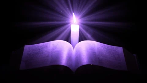 Christian Bible with Candle Lightrays Stock Footage 317840752