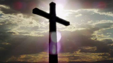 Christian Cross with Clouds and Sunbeams close up Stock Footage