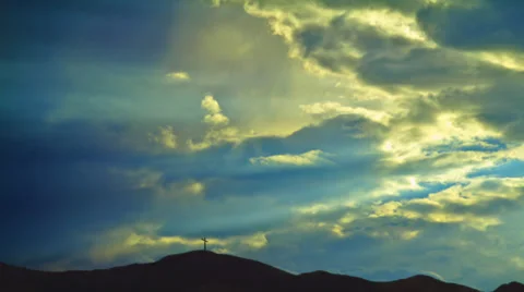 Christian Cross on Distant Hill with Clouds and Sunbeams Vídeo Stock 29664681