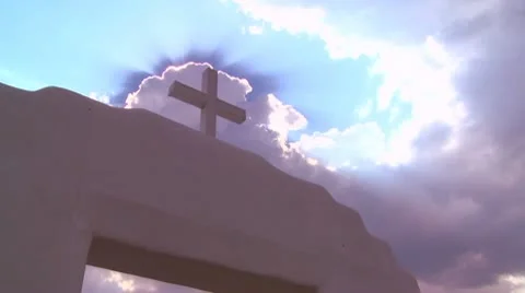 A Christian cross glows against a heavenly sky. Stock Footage