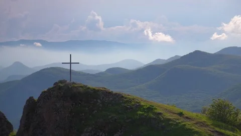 Christian cross standing on a mountain summit Stock Footage 340264297