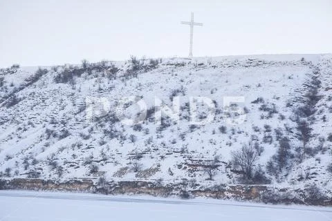 Christianity cross on the hill Stock Photos