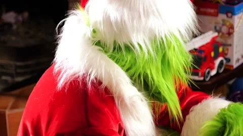 Christmas actor in handmade Grinch in Santa costume Stock Footage