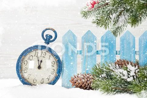 Christmas alarm clock and fir tree Stock Photos