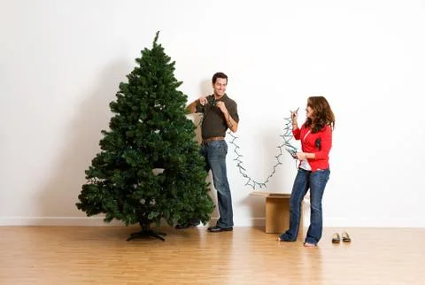 Christmas: almost finished adding christmas lights Stock Photos