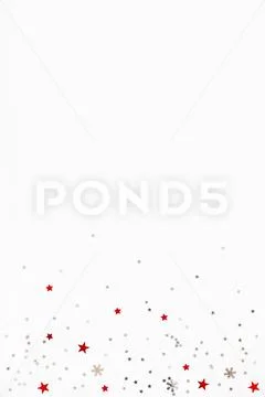 Christmas and New Year background with sparkling red and silver stars confett Stock Illustration