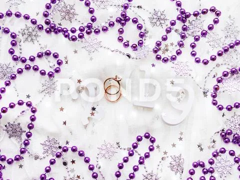 Christmas and New Year background with numbers 2019, wedding rings with diamo Stock Photos