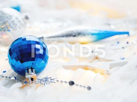 Christmas and New Year holiday background with decorations and light bulbs. S Stock Photos
