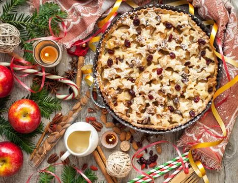 Christmas appleon a rustic tabletop. Stock Photos