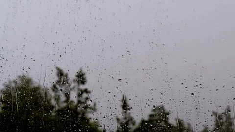 Christmas Background 4K Vew of a window covered in rain Stock Footage 255491775