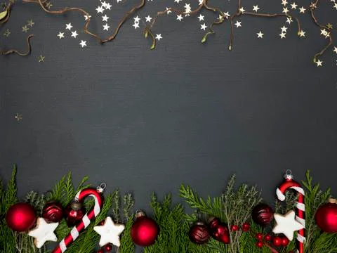 Christmas background on black background with different red christmas items Foto stock