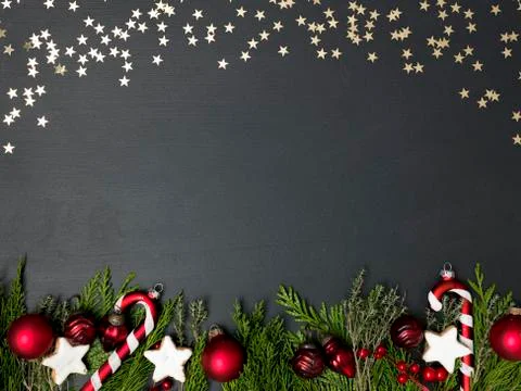 Christmas background on black background with different red christmas items Foto stock