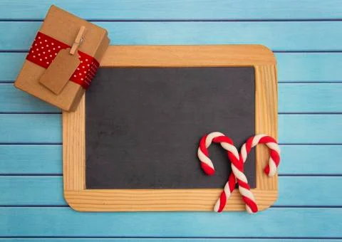 A Christmas Background with a Blank Chalkboard for Adding Text Stock Photos