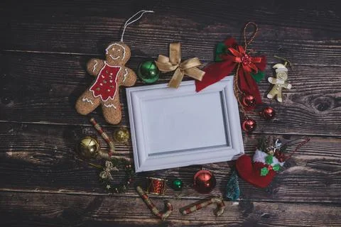 Christmas background blank frame for text with decorations on dark wooden b.. Stock Photos