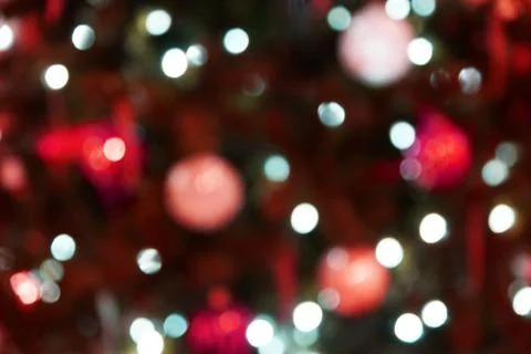  Christmas background, bright light spots, blurred Christmas decorations, red Stock Photos