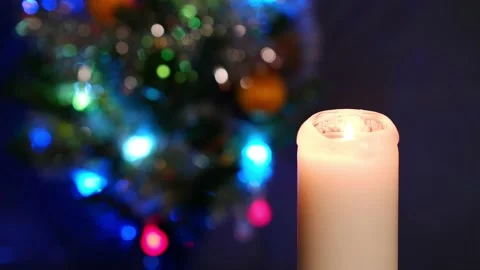 Christmas background. The candle is lit on a blurred background. Stock Footage 167082425