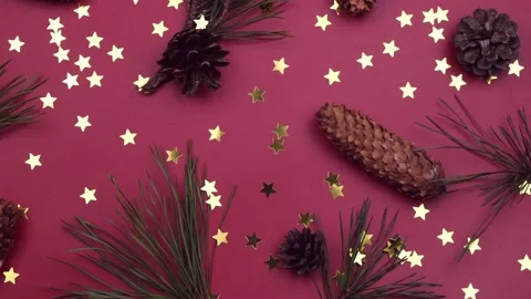 Christmas background Christmas tree branches star confetti, cones rotating Stock Footage 166320667