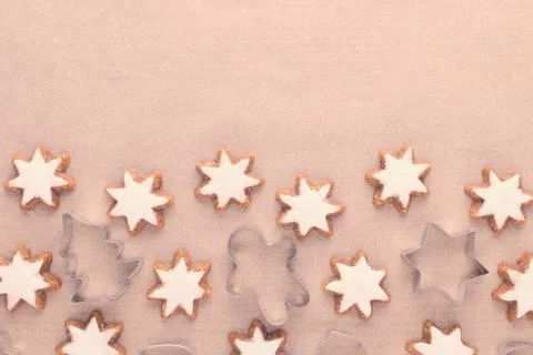 Christmas background with cookie cutter and star cookies on baking paper, copy Stock Photos