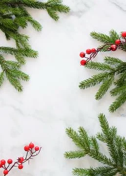 Christmas background with copy space. Top view fir tree branches frame on marble Stock Photos