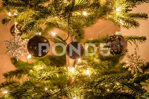 Christmas background of de-focused lights decorated tree illuminated moody Stock Photos