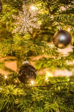 Christmas background of de-focused lights decorated tree illuminated moody Stock Photos