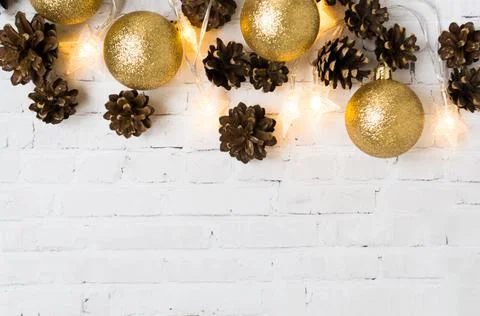 Christmas background with fir cones and golden holiday balls. Christmas Stock Photos