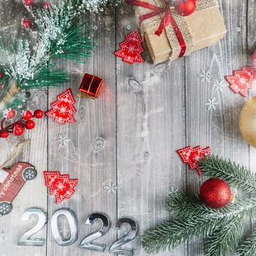 Christmas background of flatlets with a gift, and Christmas decorations on a Stock Photos
