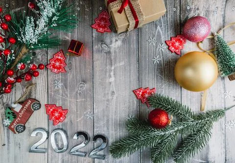 Christmas background of flatlets with a gift, and Christmas decorations on a Stock Photos