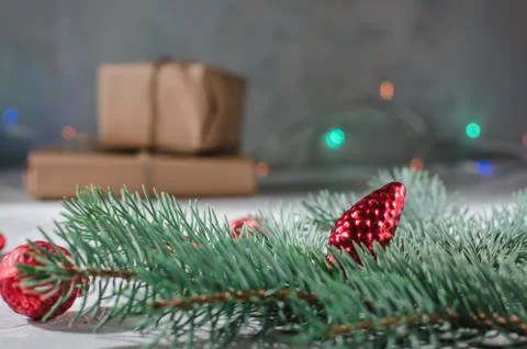 Christmas background. Gift box with a sprig of a Christmas tree  Stock Photos