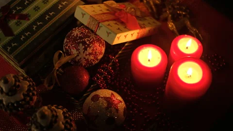 Christmas background with gift boxes and candle on dark background. White Video stock 144469851