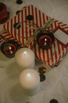 Christmas background with gift boxes, clews of rope, paper's rools, pine tree an Stock Photos