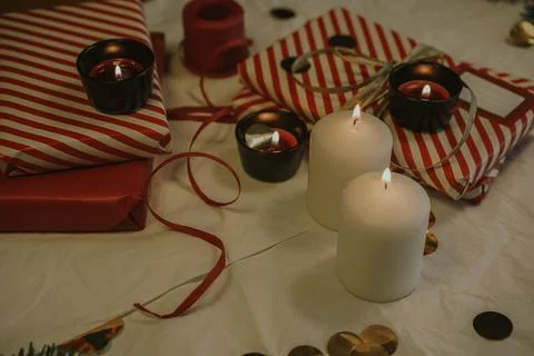 Christmas background with gift boxes, clews of rope, paper's rools, pine tree an Stock Photos
