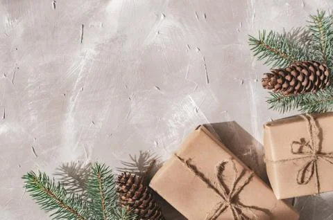 Christmas background. Gift boxes with a sprig of a Christmas tree Stock Photos