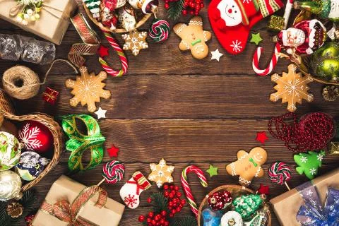 Christmas background with gifts, toys, tree branches, New Year decor, candies Stock Photos