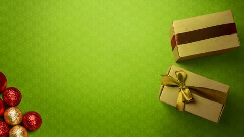 Christmas background with green snowflake patterned paper, two gift boxes w.. Stock Photos