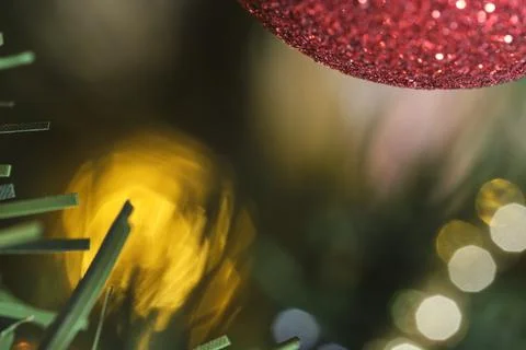 Christmas background, macro image of a tree decorated with ornaments and ligh Stock Photos