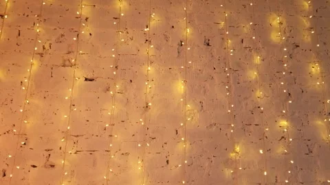 Christmas background made of glowing LED garlands on a brick wall Stock Footage 294942857