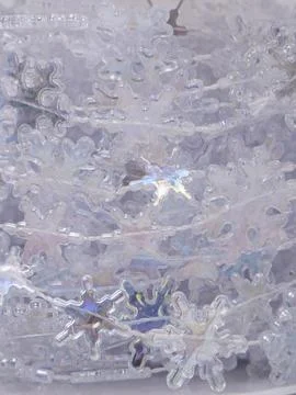 Christmas background made of pearlescent thread with large snowflakes 库存照片