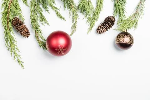 Christmas background made with pine branches, pine cones and Christmas decora Stock Photos