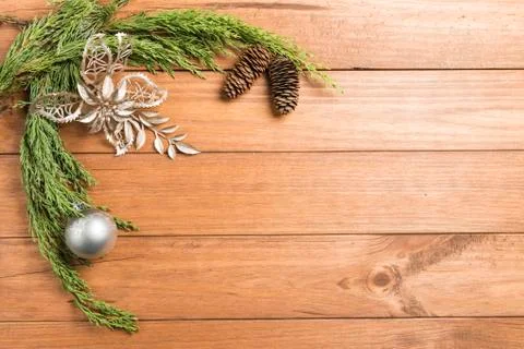 Christmas background made with pine branches, pine cones and Christmas decora Stock Photos