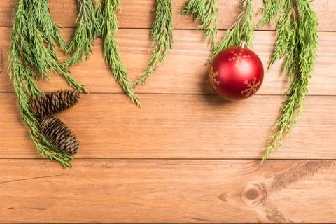 Christmas background made with pine branches, pine cones and Christmas decora Stock Photos