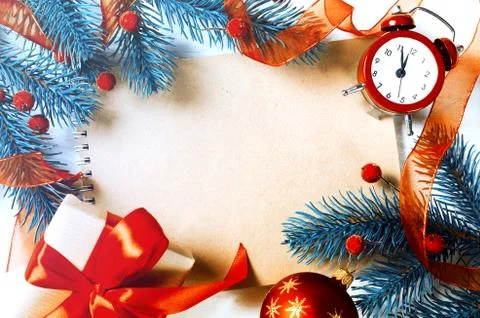 Christmas background with notebook and clock. Stock Photos