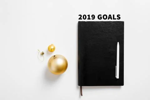 Christmas background with notebook, copy space. Template new year goal resolu Stock Photos