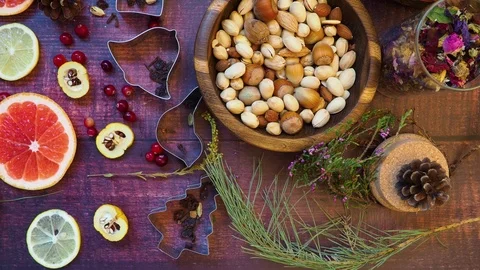 Christmas background of nuts, dried apples, fresh grapefruit, lemon, cydonia sli Stock Footage 117577814