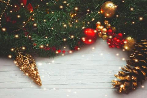 Christmas background - pine cone and ornaments on wooden background with ch.. Stock Photos